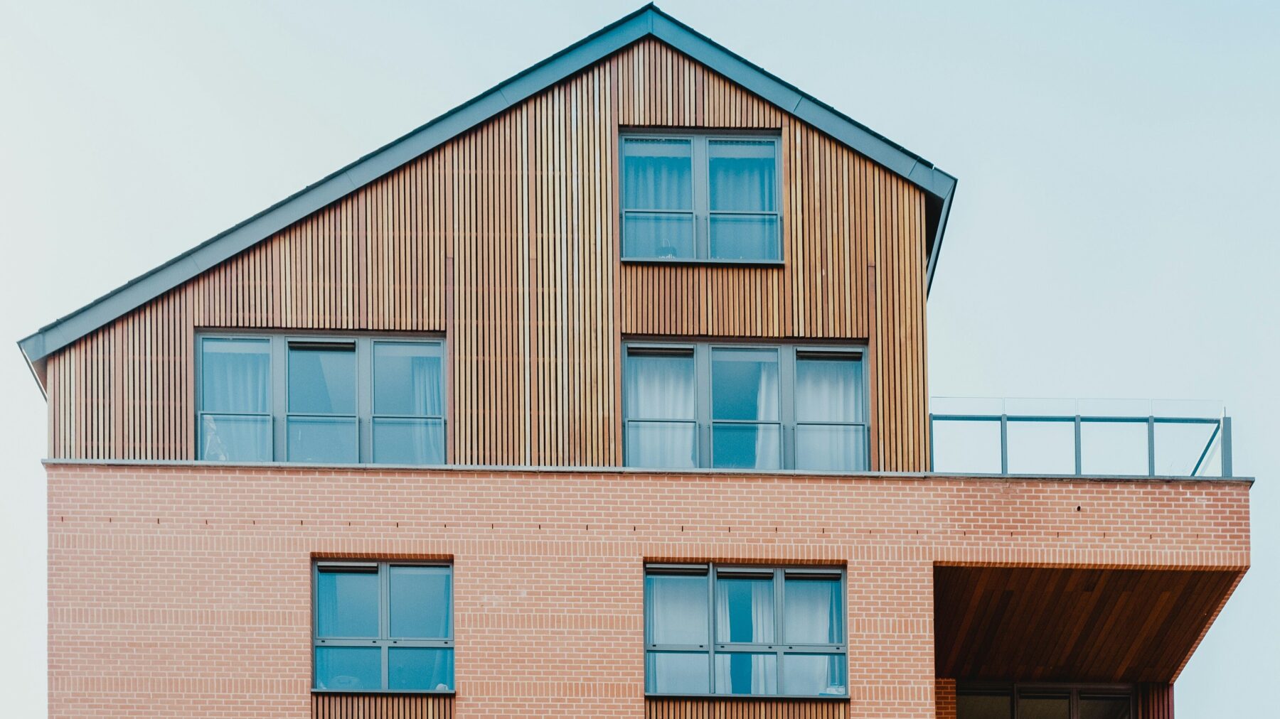 estoppel in real estate- modern condo building in salmon color and wooden elements