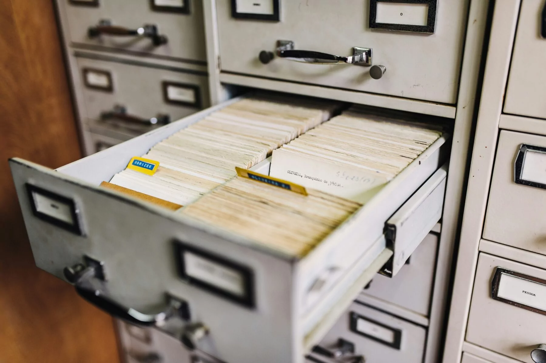 a metal filing cabinet with mini files inside