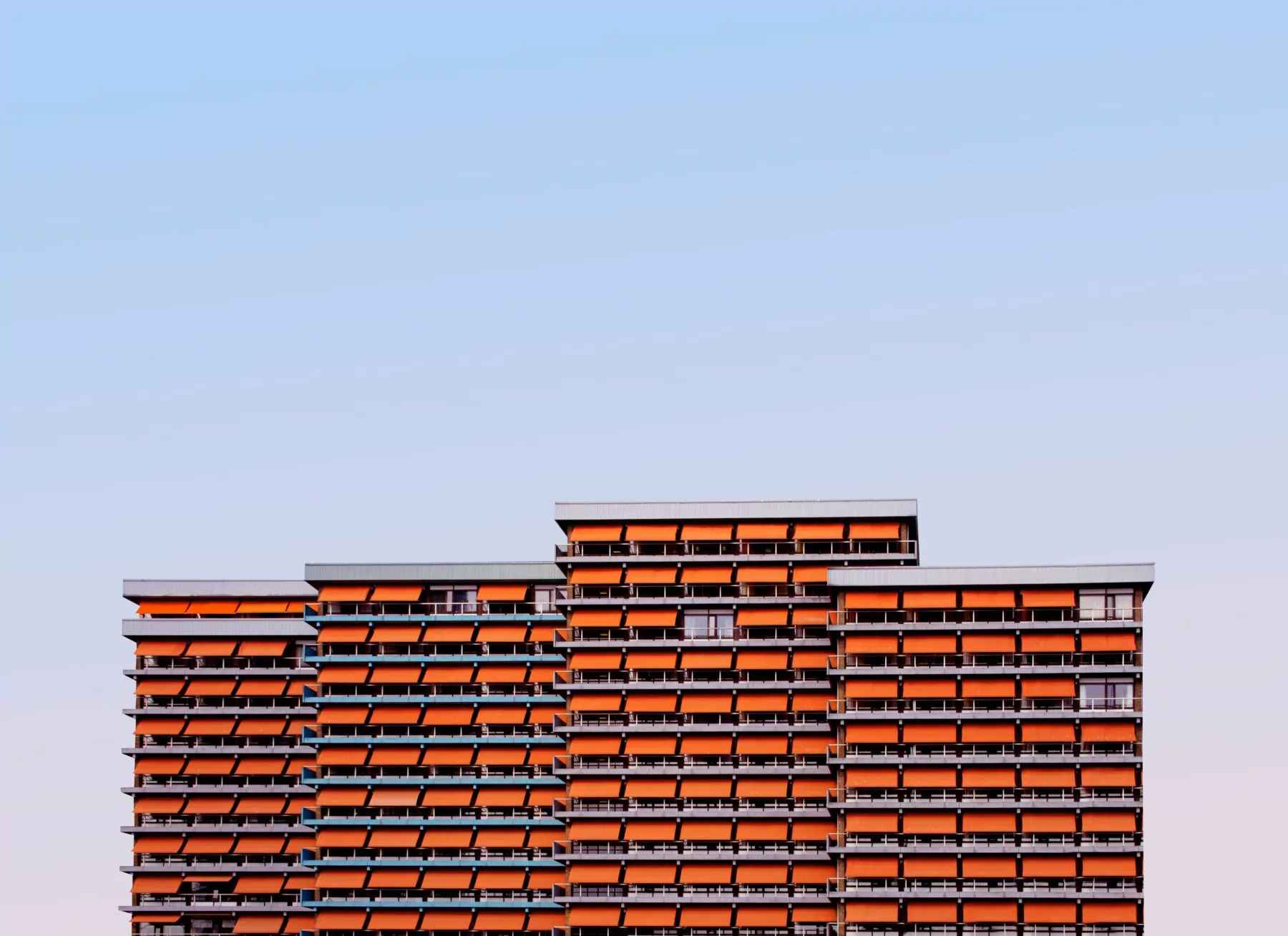 orange and gray tall building on blue gradient font-types of liens article