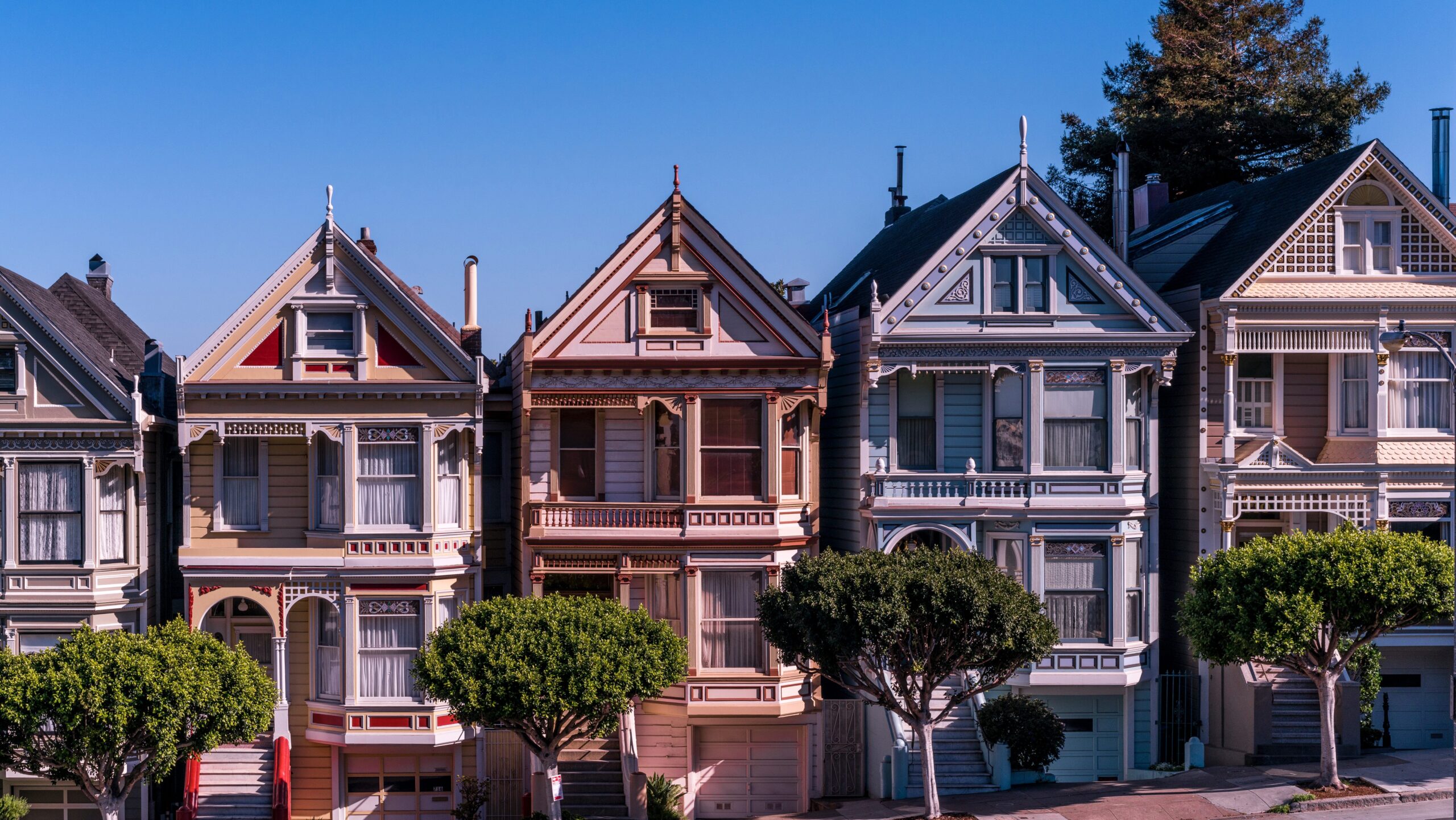 three colorful houses in one row