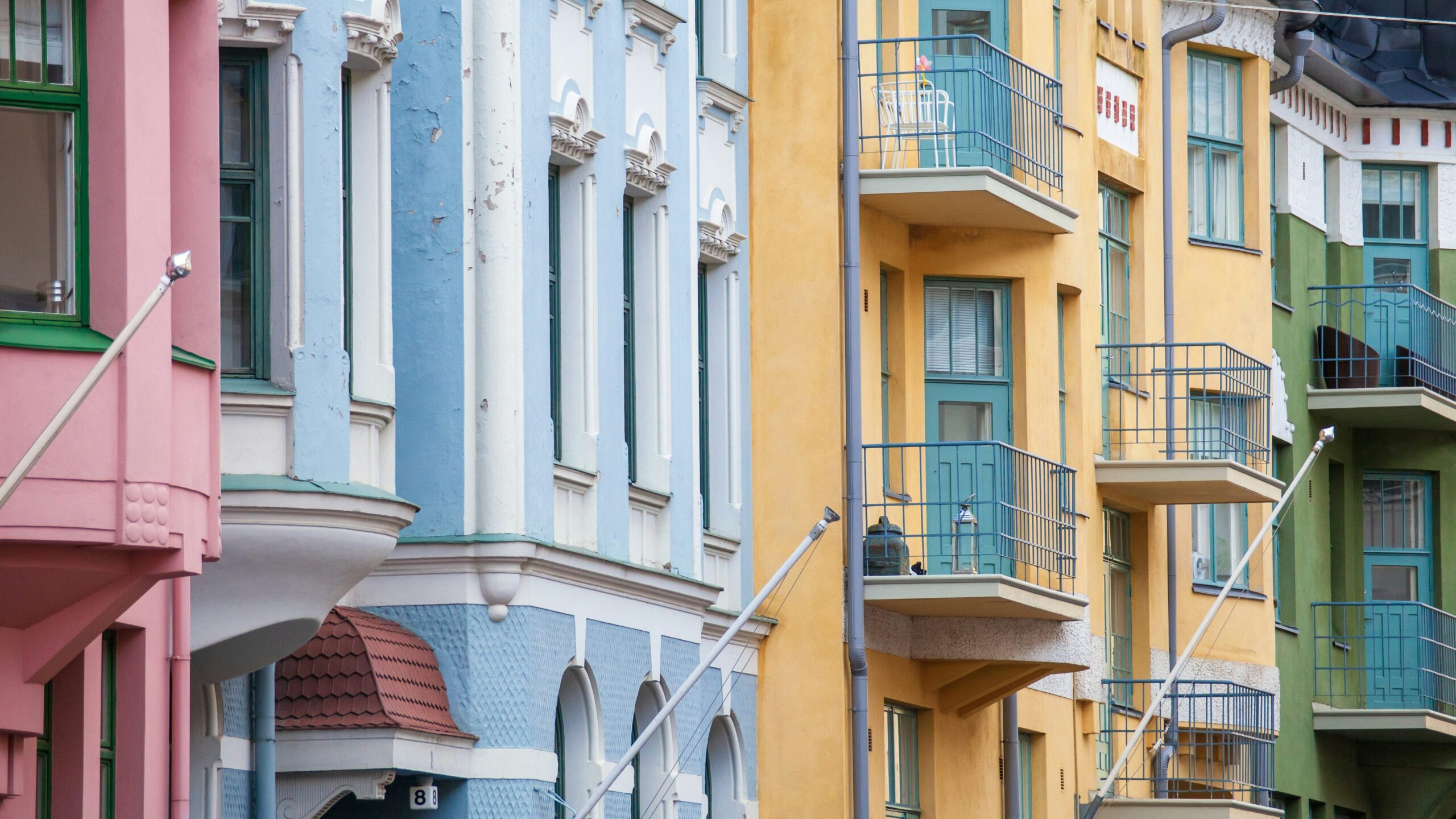 blue and orange old houses with balconies, europe- types of liens article