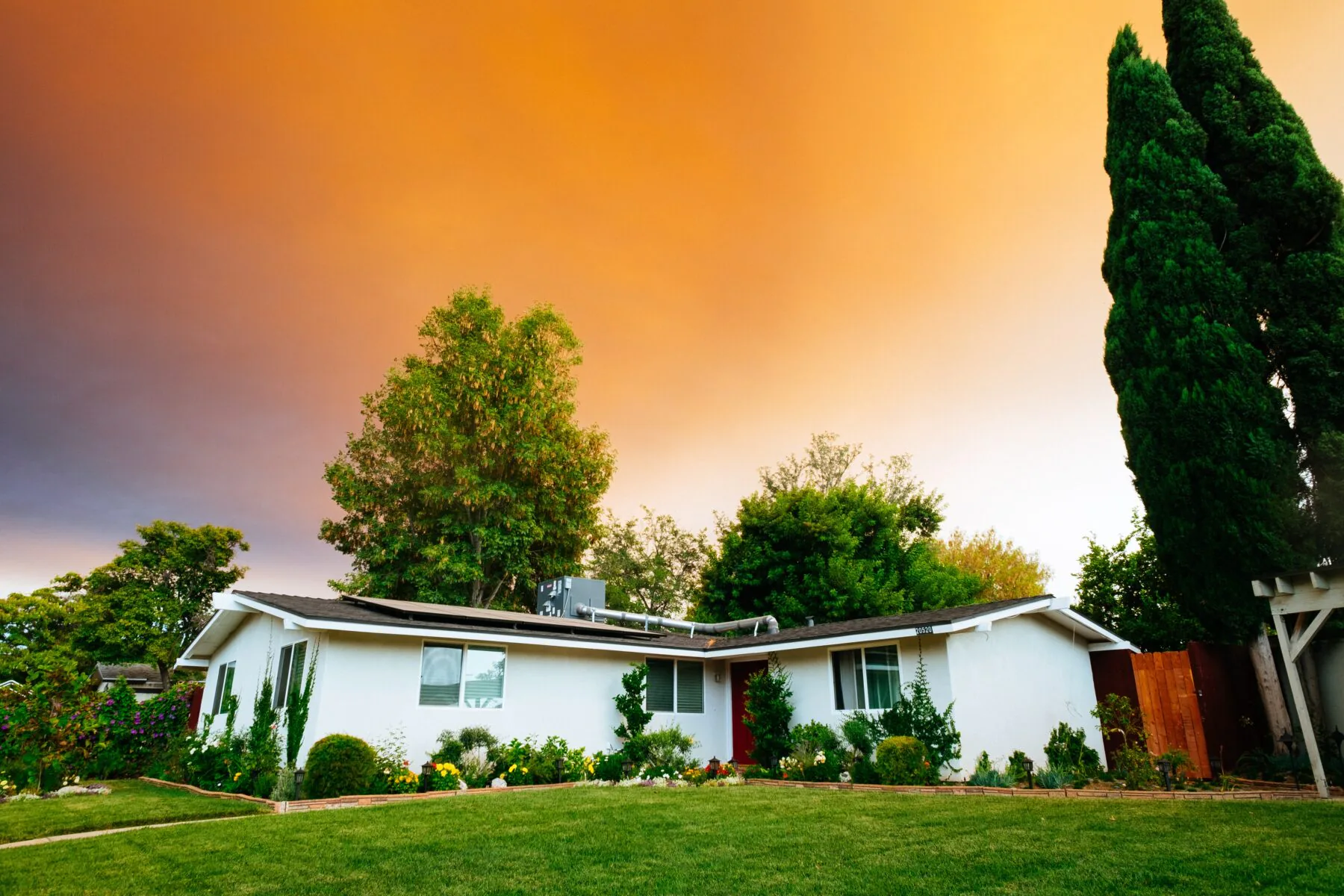 one story house white on a colorful sunset mortgage payoff